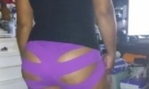 Big booty Latina rocking purple shorts