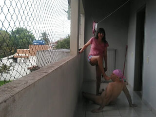My wife teasing me on balcony