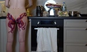 Naked housewife with octopus tattoo on ass cooks dinner