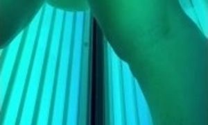 Fitness girl plays in the tanning bed after a workout and shows off her asshole and pussy