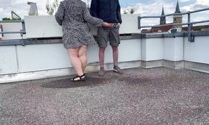 Gorgeous pissing mother-in-law helps son-in-law piss on the top of the parking lot