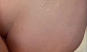 Wife bends over in the shower