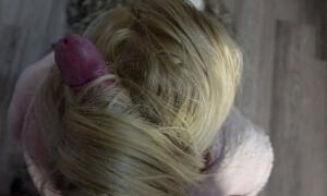 Mistress in fur robe uses her long blonde hair for blowjob