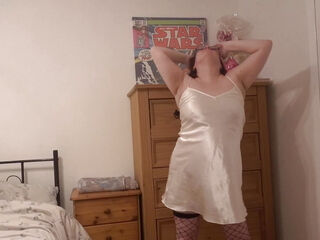 Dancing striptease in silk slip and stockings