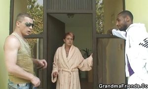 Redhead granny gets 3some with BBC and white cock