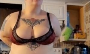 Busty teen dancing while playing with huge tits