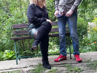 Mature milf in sexy clothes helps a man pee outdoors