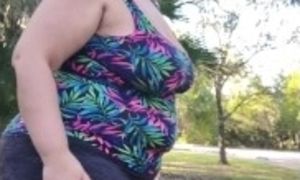 Voyeur thick body in the park, bubble butt tight yoga pants stretching.