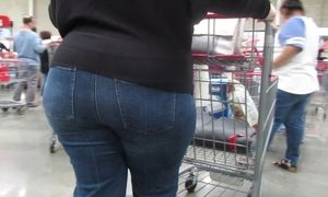 Mature good-sized bum in taut denim and high-heeled slippers