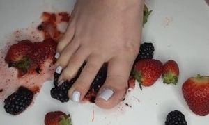 Latina wife Steps on black berries while husband watches.