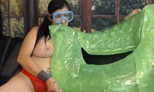 Blowing Up Green Pool Toy in Snorkel Mask