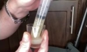 loading a syringe of my thawed cum loads to inject into my wifeâ€™s pussy (surprise)
