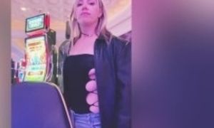 Sexy MILF wears a see-through top while gambling in Vegas