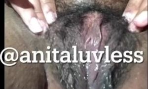 Mulatto shows hairy, creamy pussy
