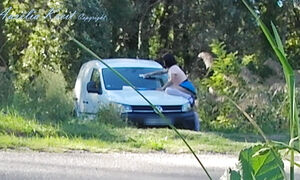 Outdoor car windows cleaning by the road