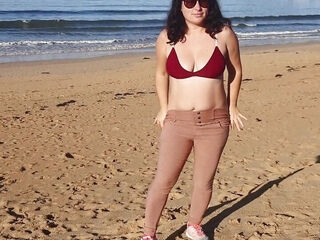 Woman Pissing on a Public Beach While No One Is There